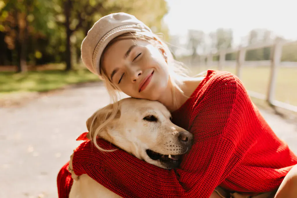 Resident enjoying time outdoors with her dog