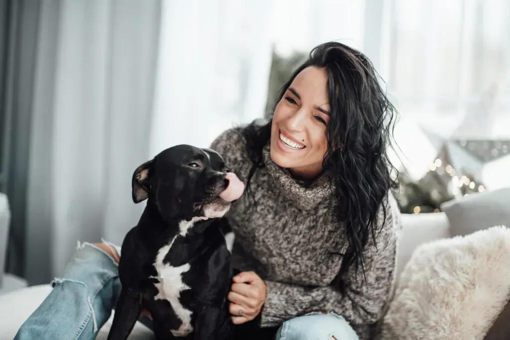 Resident relaxing at home with her dog
